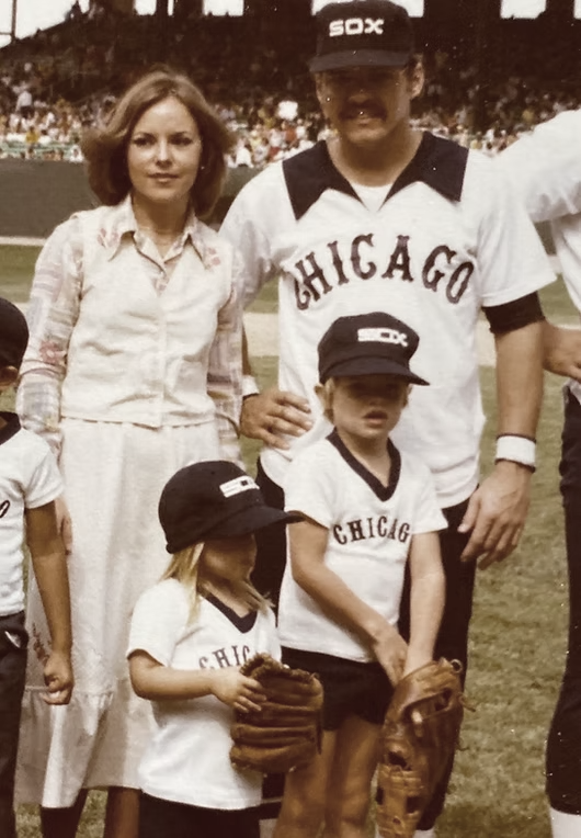 The Soderholm family on the field, the children in matching White Sox uniforms