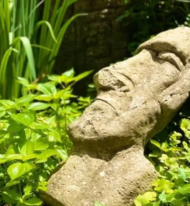 Stone statue resting in the garden